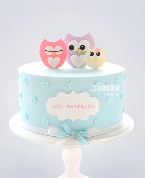 Голубой торт с совятами и бантиком Фото