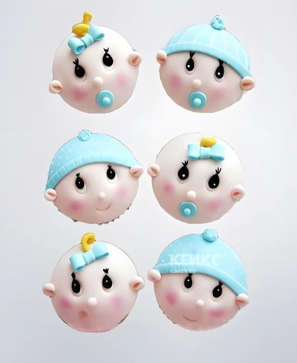 Капкейки на выписку из роддома в виде малышей Фото