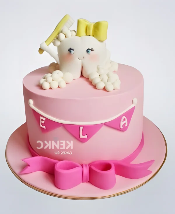 Торт в виде зубика с желтым бантом Фото