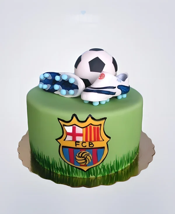 Футбольный торт Барселона с эмблемой и бутсами на поле Фото
