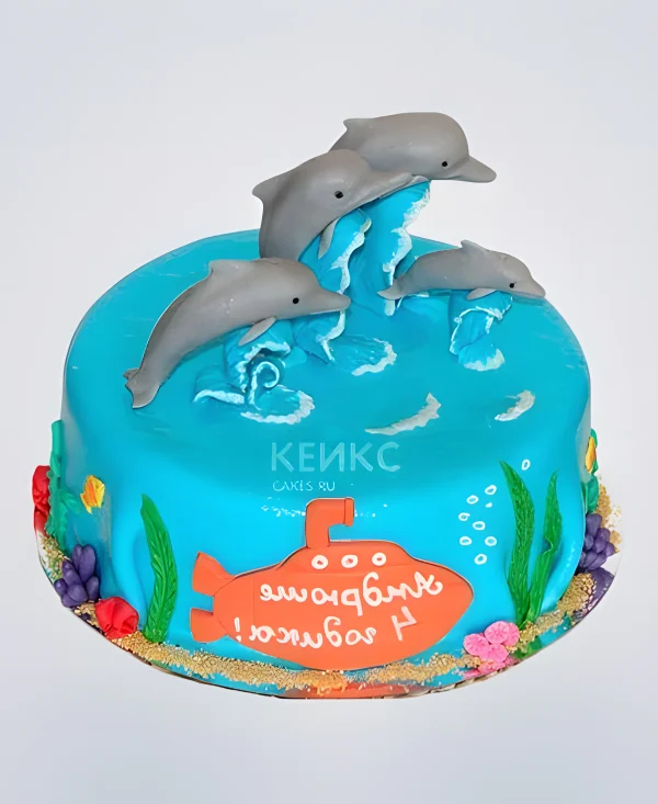 Торт с фигурками дельфинов в океане Фото