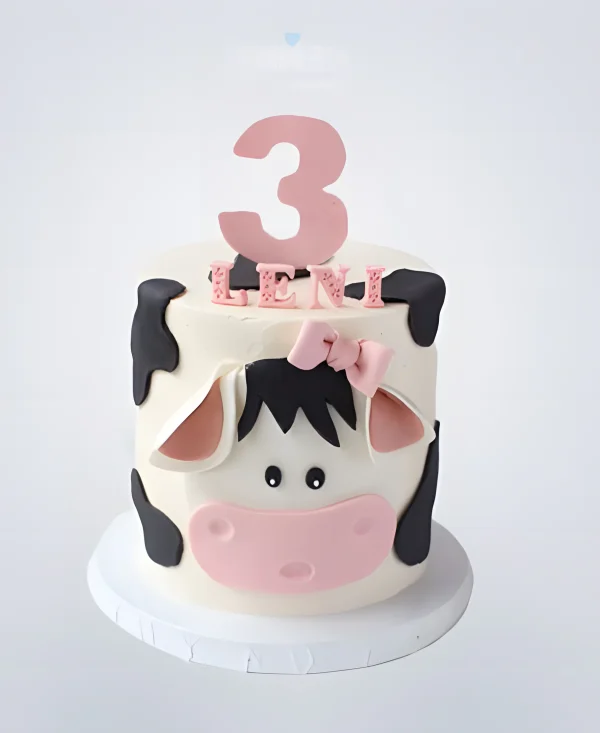 Торт в виде коровы с розовой цифрой Фото