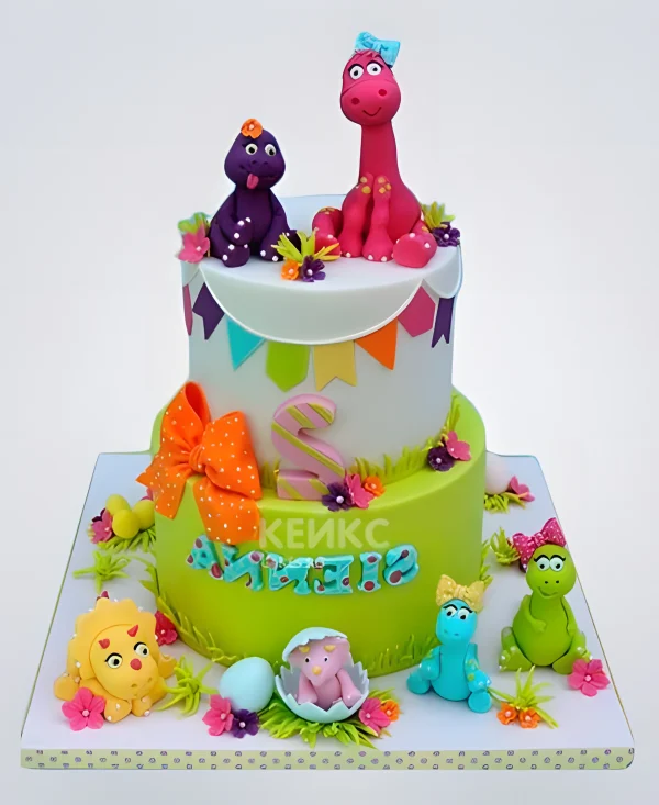 Разноцветный двухъярусный торт с динозаврами Фото