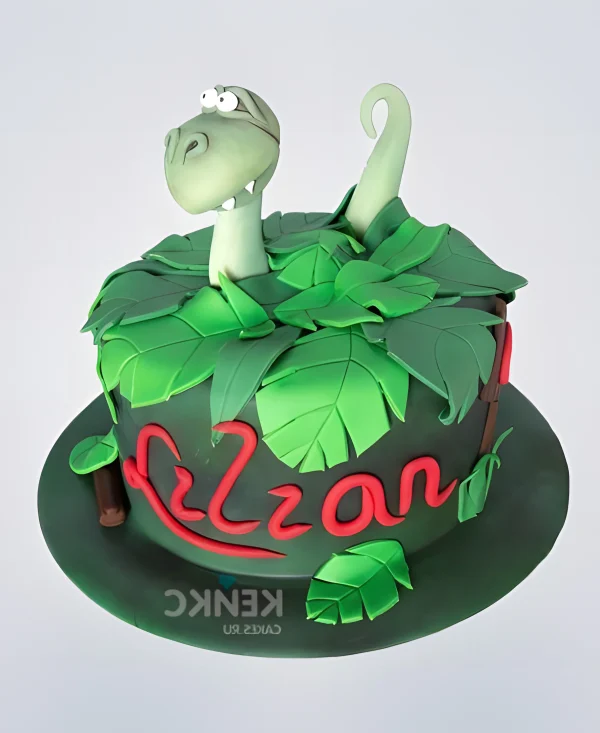 Яркий торт зеленый с динозавром Фото