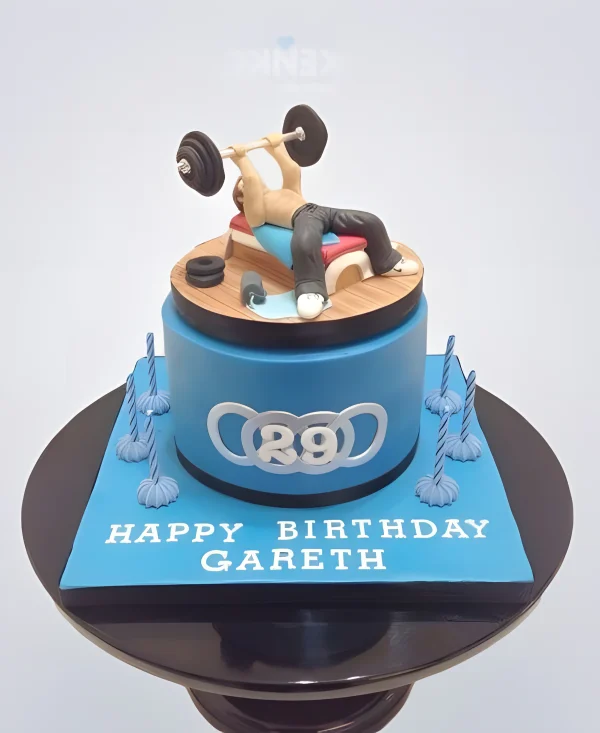 Торт Легкая атлетика с фигуркой спортсмена и штанги Фото