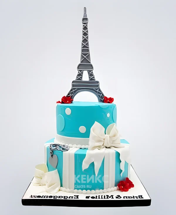 Торт Эйфелева башня бирюзового цвета и красными цветами Фото