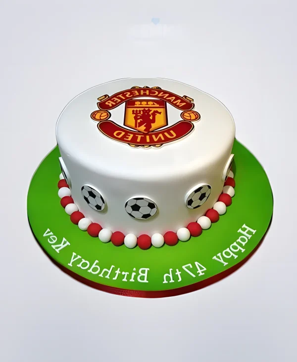 Круглый торт Манчестер Юнайтед с эмблемой Фото