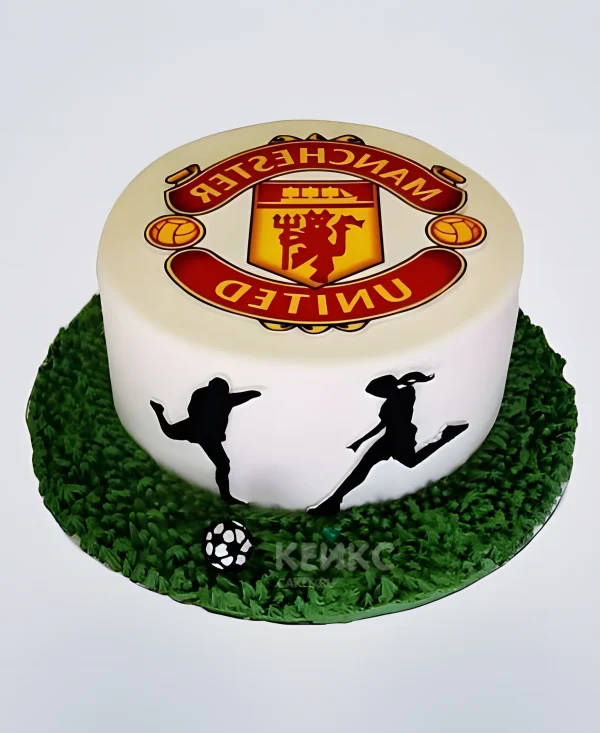 Торт Манчестер Юнайтед с зеленым полем и логотипом Фото