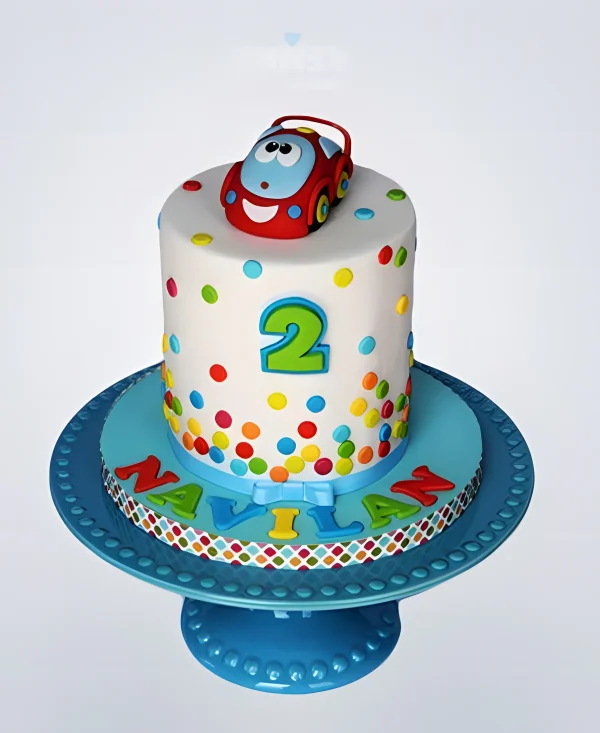 Торт с разноцветными кружками и машинкой Фото