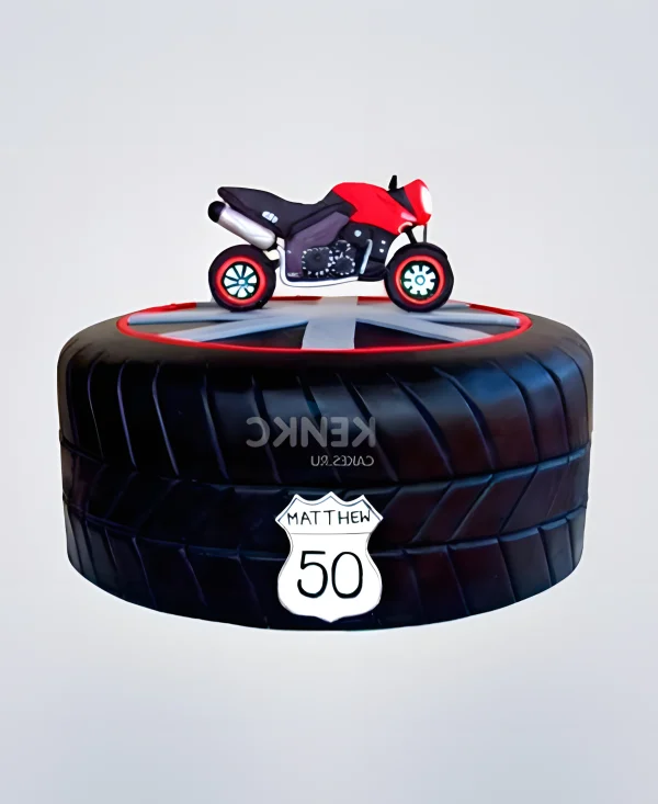 Торт в виде колеса с мотоциклом Фото