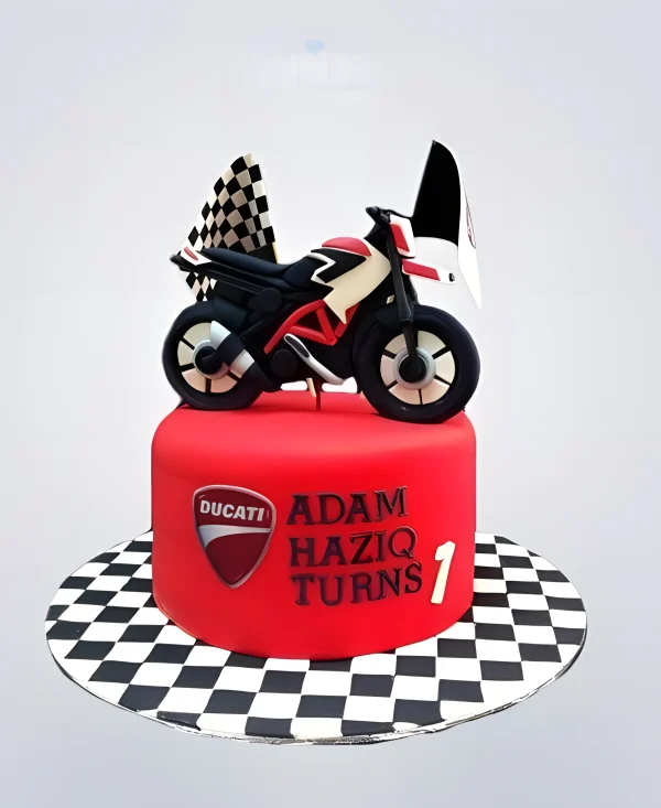 Красный торт с мотоциклом и флажками Фото