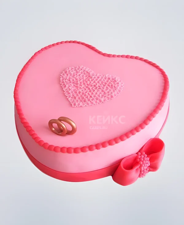 Торт на розовую свадьбу с сердцем и бантом Фото