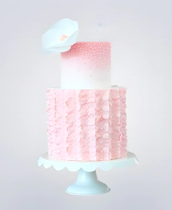 Двухъярусный розовый торт с бусинами и белым цветком Фото