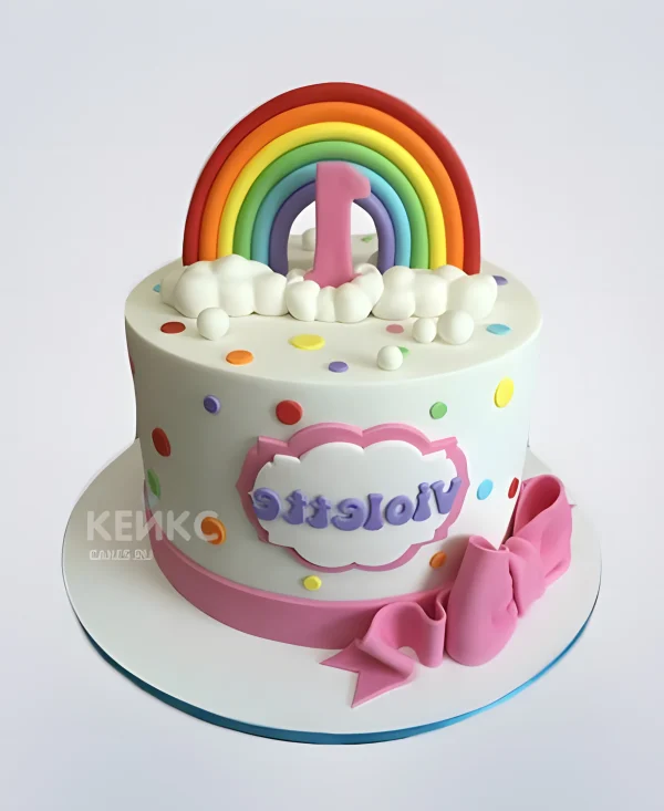 Торт в разноцветный горох с радугой и бантом Фото