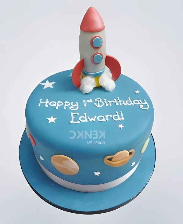 Голубой торт с надписью и фигуркой ракеты Фото