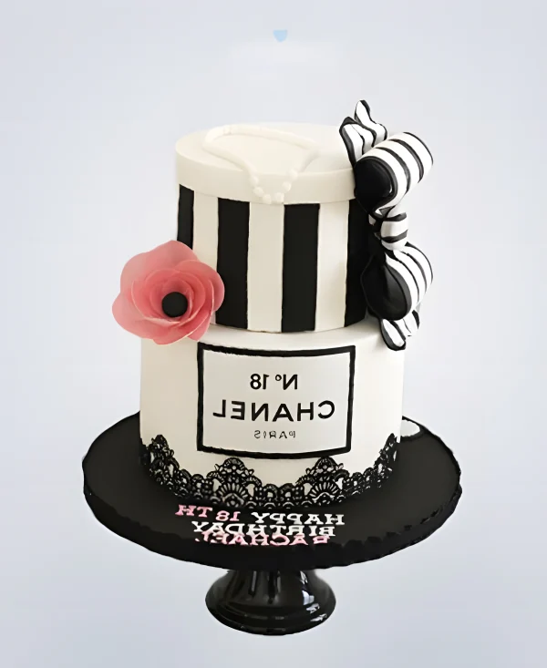 Торт шанель черно-белый с бантиком и цветком Фото