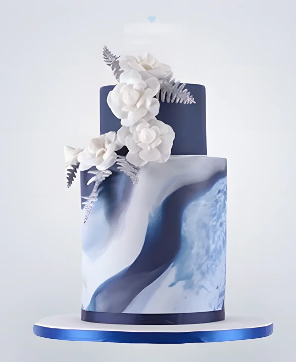 Двухъярусный синий торт с белыми цветами Фото