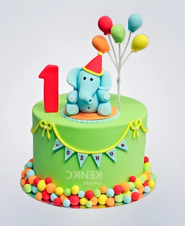 Ярко-зеленый торт со слоником с воздушными шарами и цифрой 1 Фото