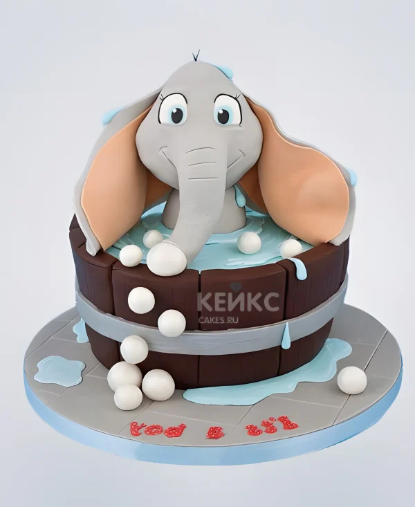 Торт в виде слоника в бассейне Фото