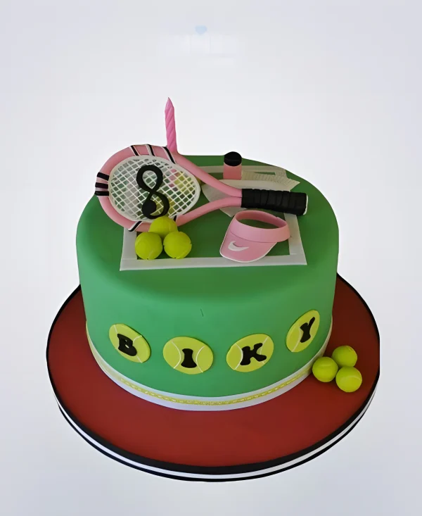 Торт теннис с розовой ракеткой и мячиками Фото