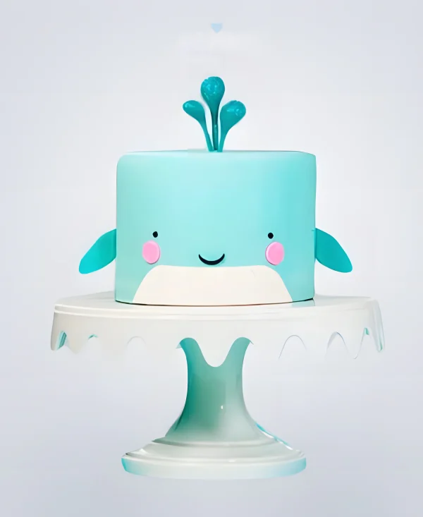 Голубой торт в виде кита Фото