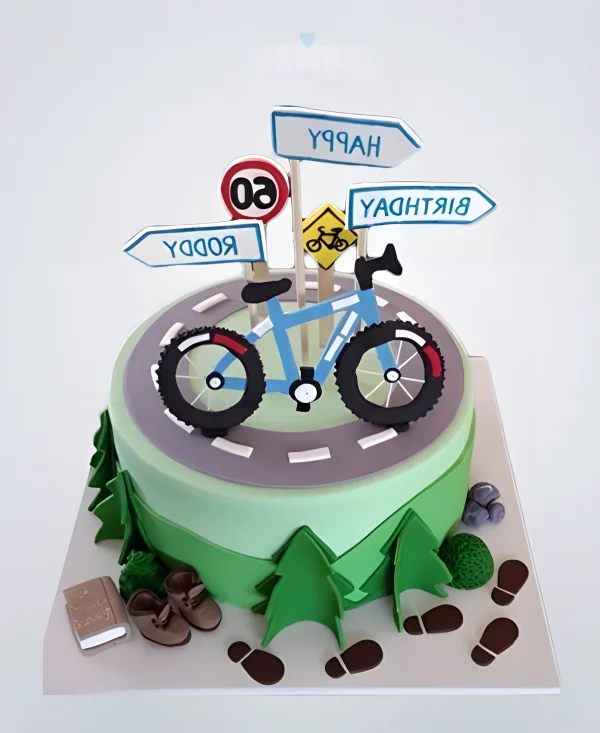 Торт с велосипедом, дорогой и знаками Фото