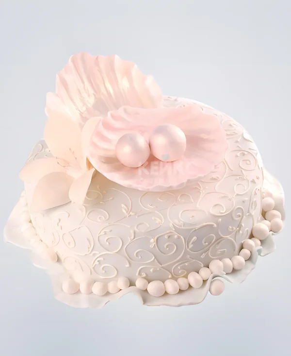 Белый торт ракушка с жемчужинами Фото