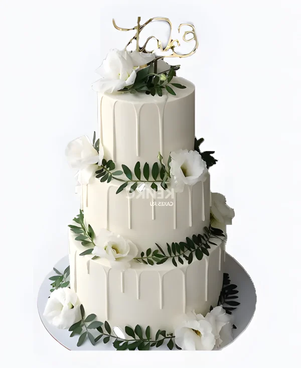 Торт с потеками и зелеными ветками с цветами Фото