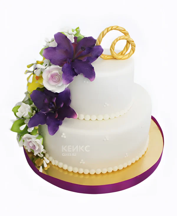 Свадебный торт с фиолетовыми лилиями и кольцами Фото