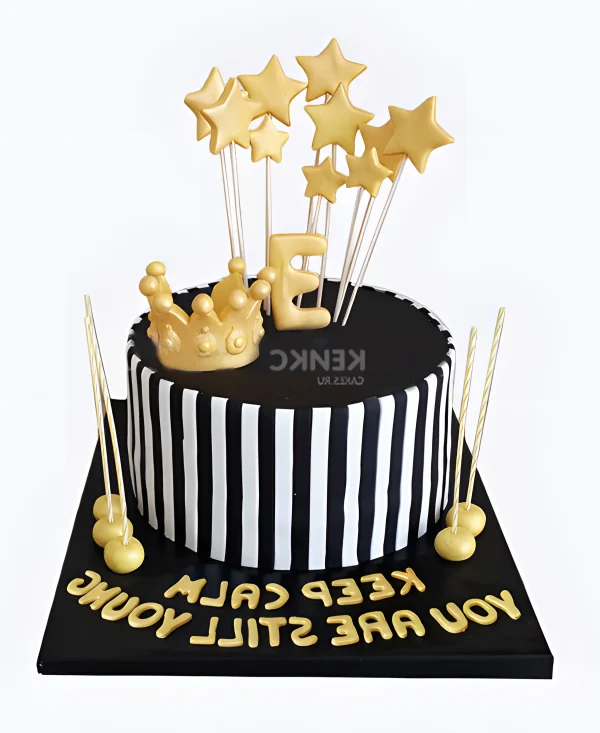 Черно-белый полосатый торт с золотыми звездами Фото
