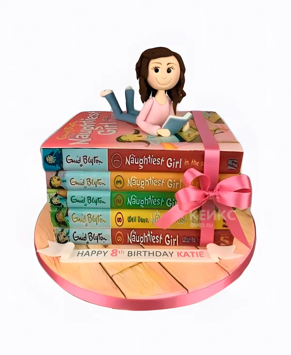 Торт с фигуркой девушки на книгах с бантиком Фото