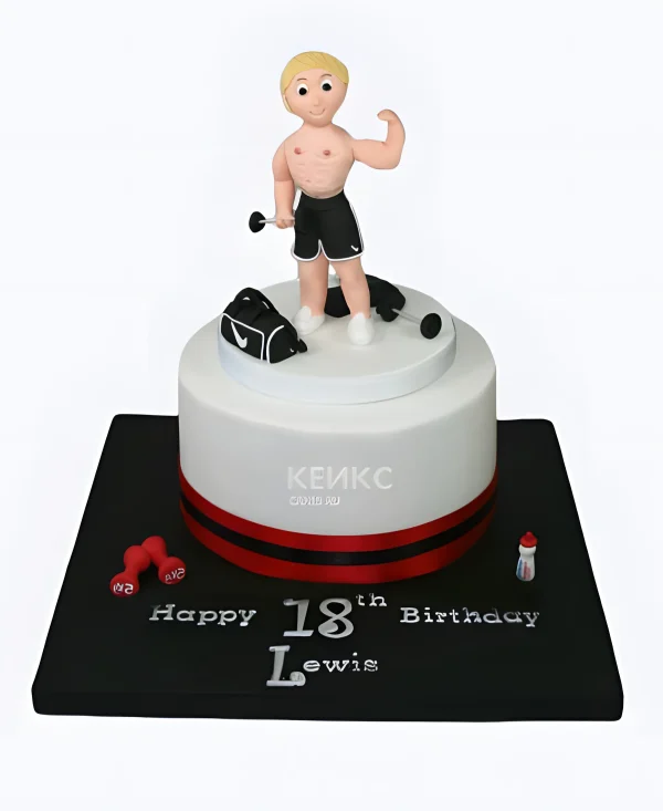Милый белый торт с фигуркой спортсмена Фото