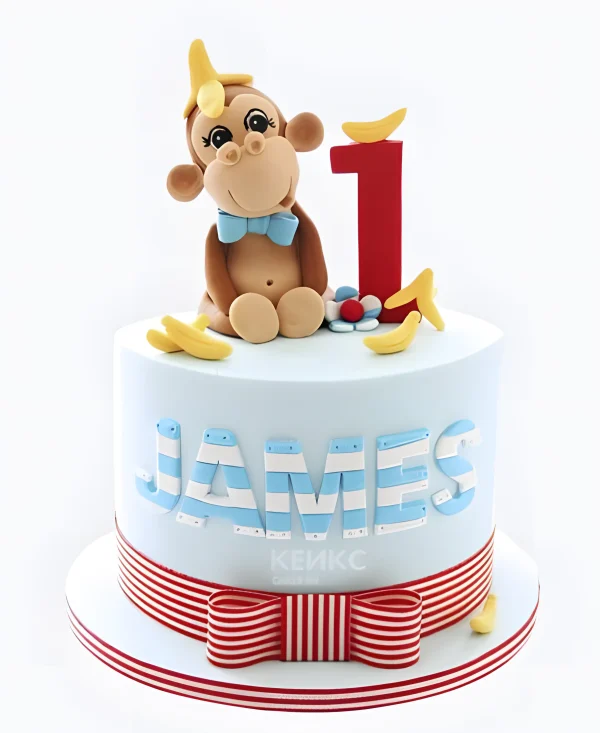 Торт с полосатым бантом и обезьяной в бананах Фото