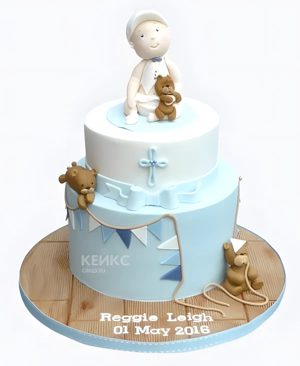 Голубой торт на крещение с фигуркой мальчика Фото