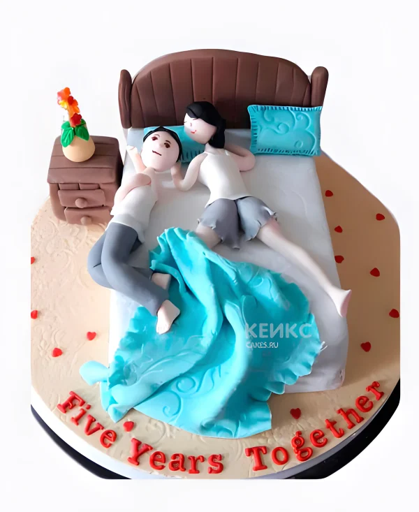 Торт в виде кровати с голубым одеялком Фото