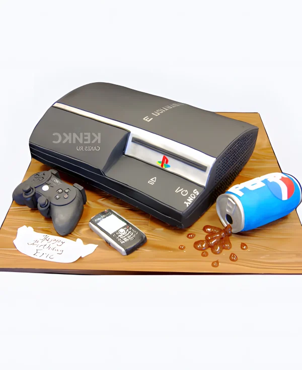 Торт в виде приставки с разлитым пепси Фото