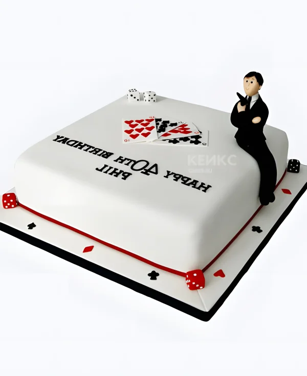 Торт белый с картами и мужчиной Фото