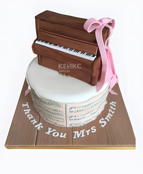 Торт с пианино и розовым бантом Фото