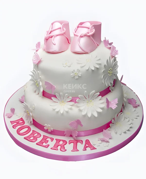 Розовый торт с пинетками на рождение девочки Фото