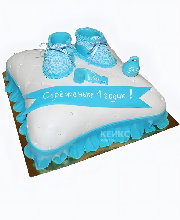 Торт в виде подушки с голубыми тапочками Фото