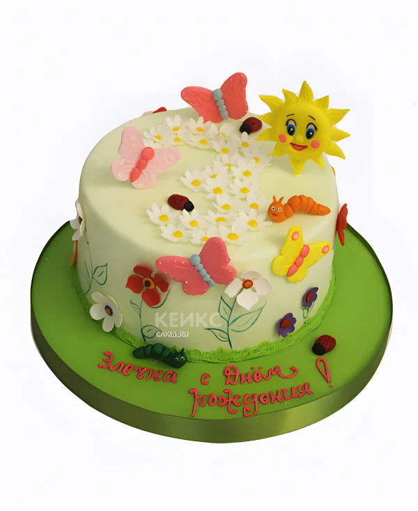Нежно-зеленый торт с бабочками и солнцем Фото