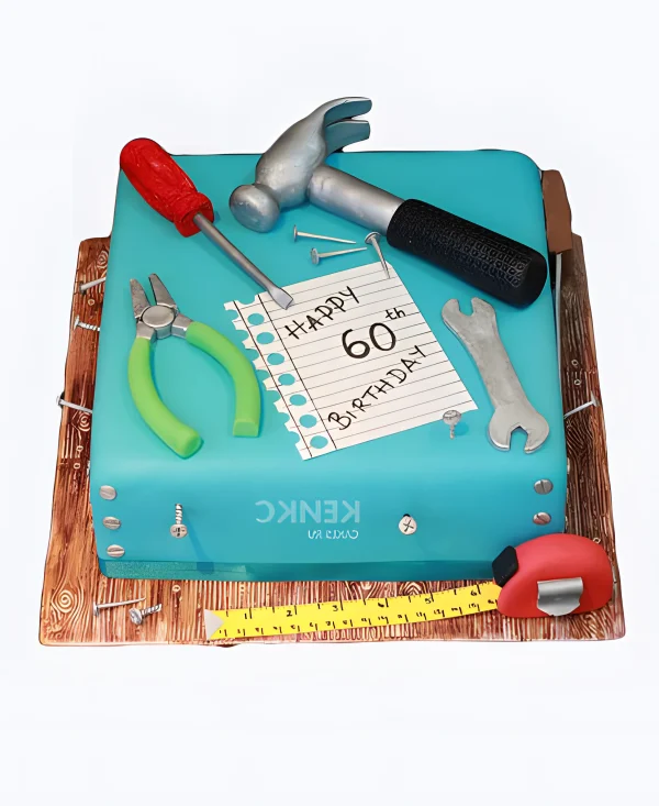 Бирюзовый торт с инструментами и цифрой Фото