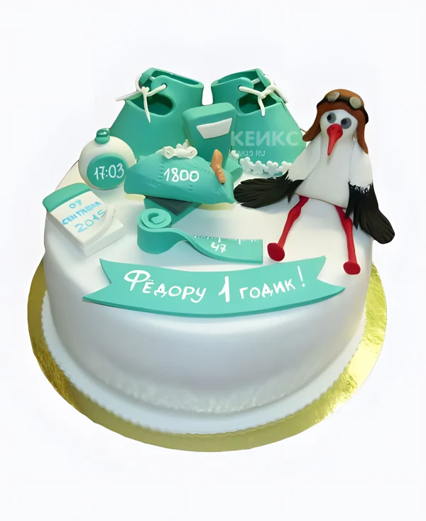 Торт с надписями и фигуркой аиста Фото