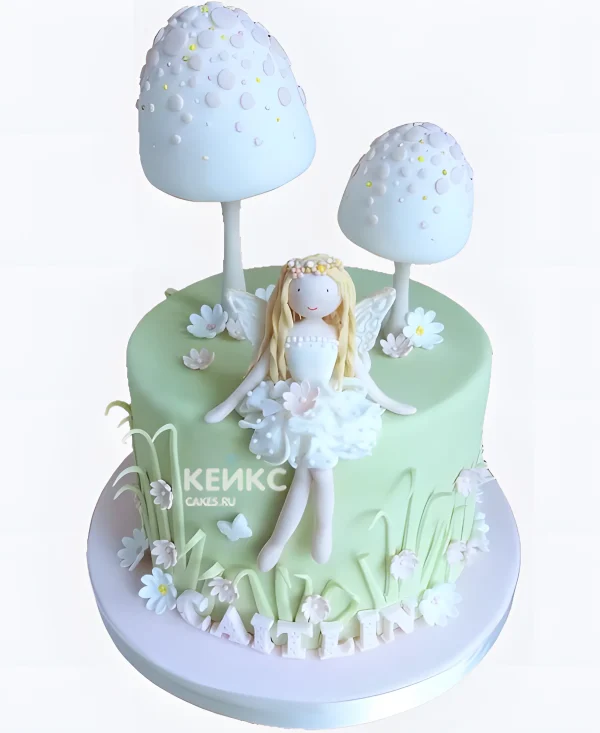 Пастельно зеленый торт с фигуркой феи Фото