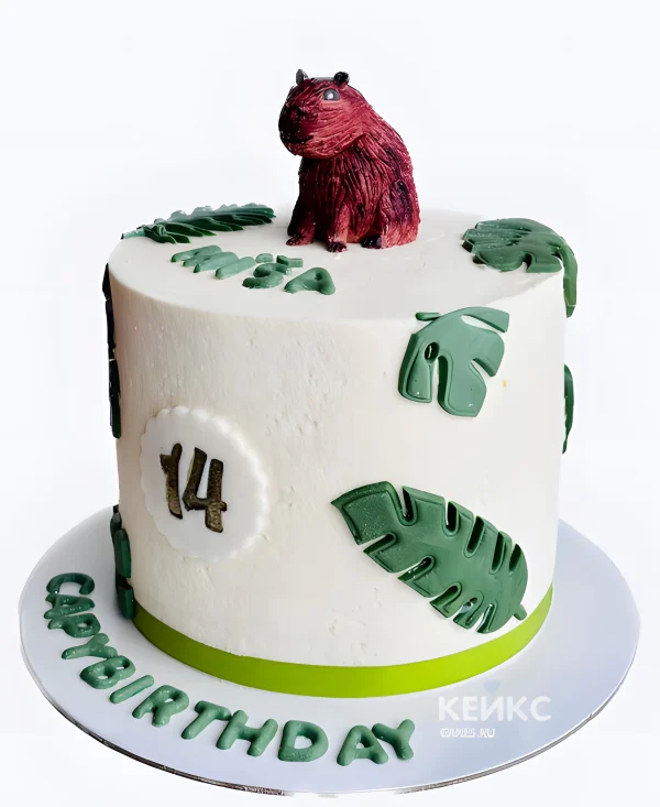 Торт с капибарой и зелеными листьями Фото