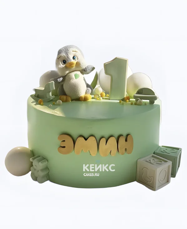 Зеленый торт с пингвином и кубиками Фото