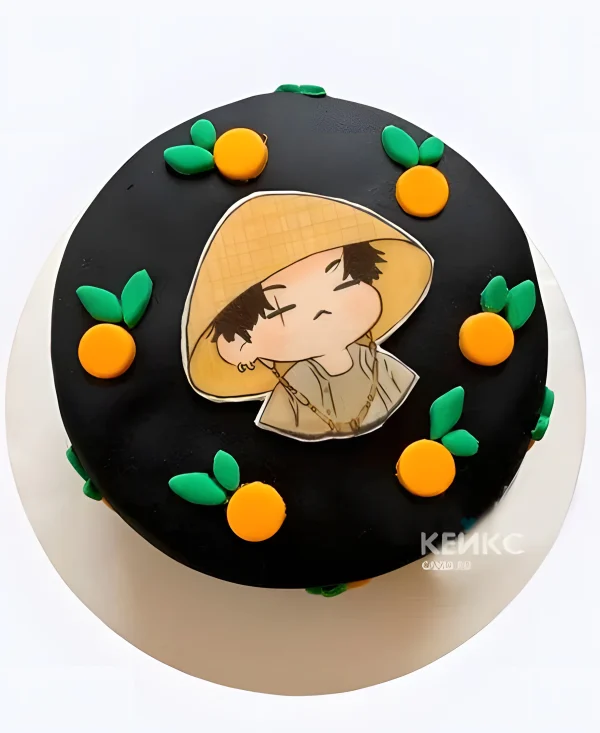 Чёрный бенто-торт с апельсинками и мальчиком Фото