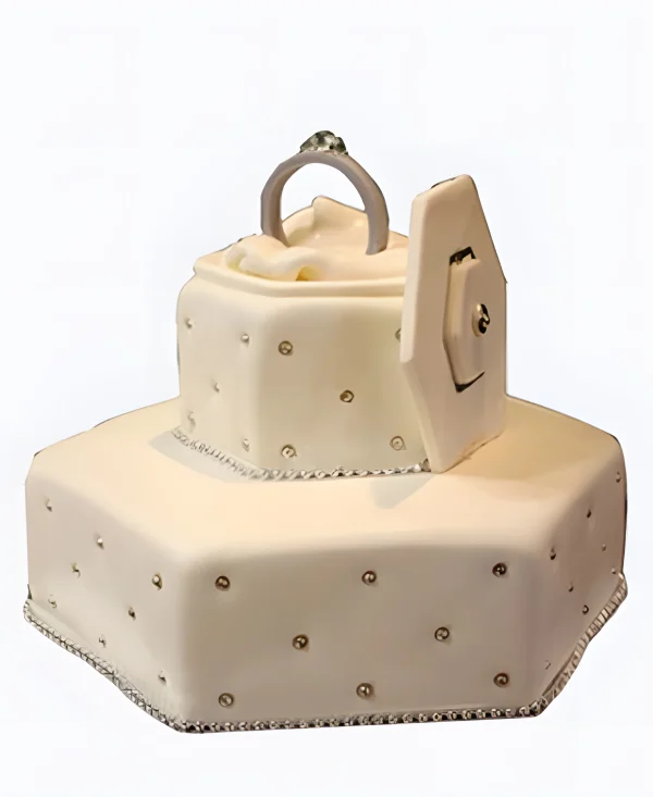 Двухъярусный торт с кольцом и бусинами на сватовство Фото