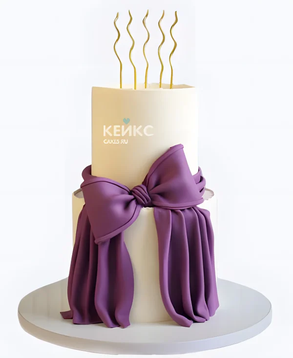 Двухъярусный торт девочке с фиолетовый бантом Фото