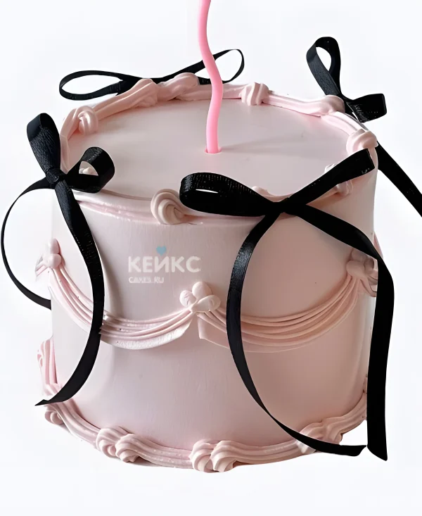 Розовый торт девочке с черными бантиками Фото